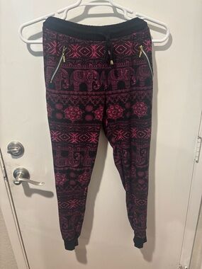Women's Black Joggers with Pink Elephant Print and Zip Pockets